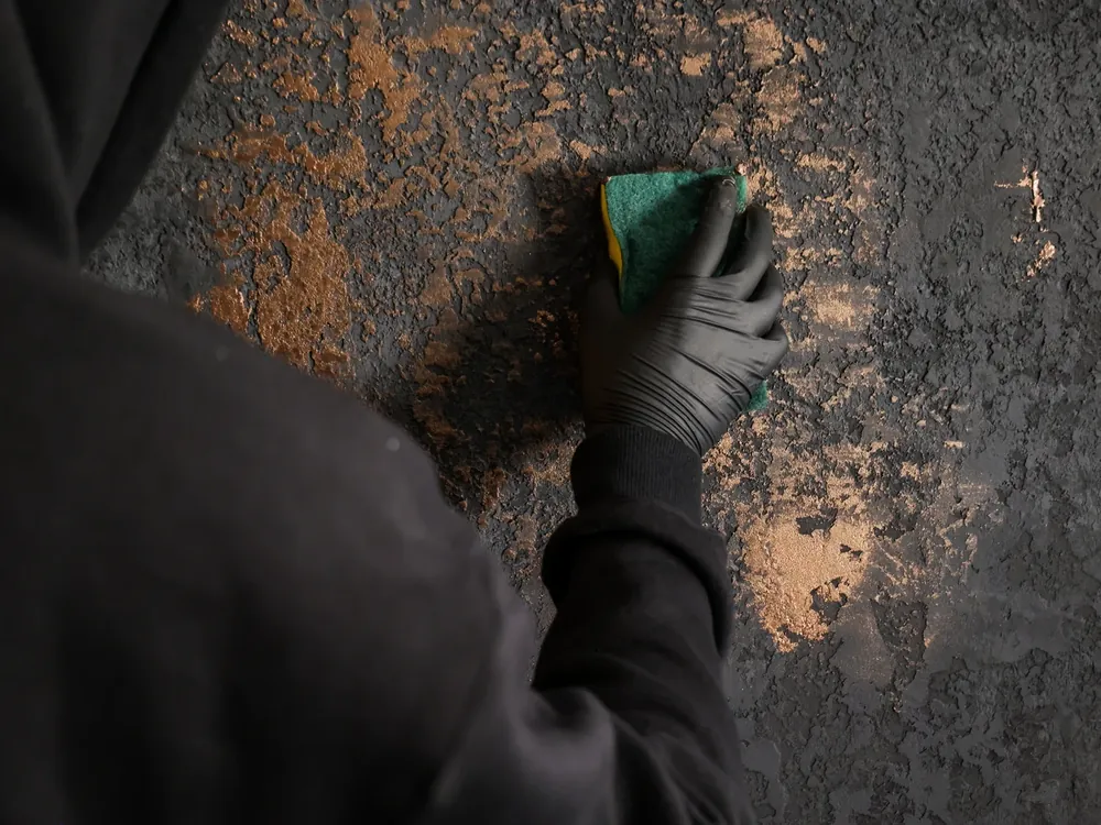 Black and bronze texture, applied by hand