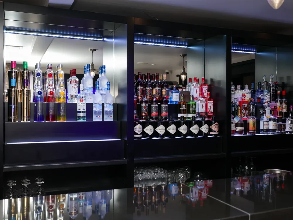 Nightclub in black and bronze textured plaster back bar